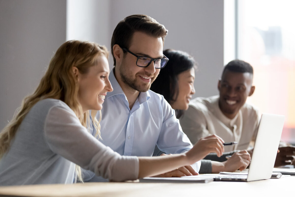 Happy,Young,Female,Employee,Discussing,Online,Project,,Showing,Computer,Presentation